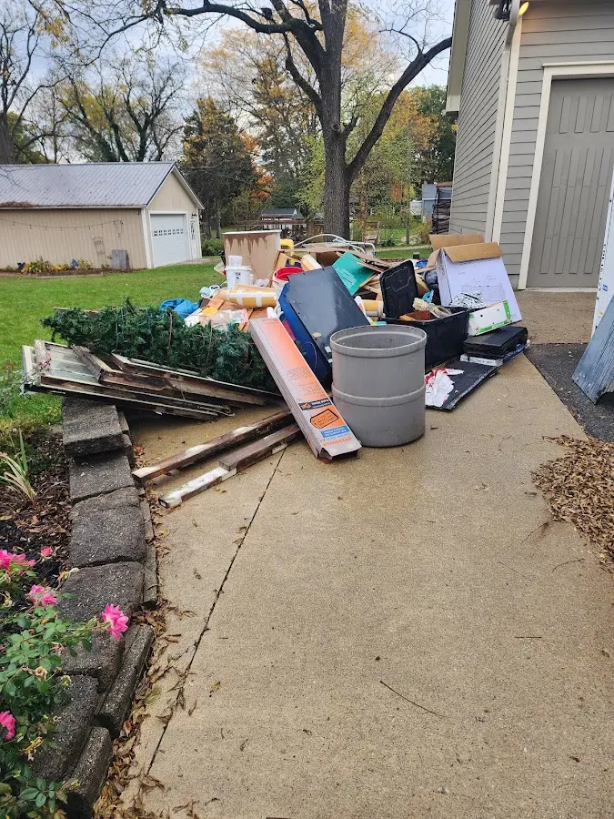 Dumpster being loaded with debris for Roofing Dumpster Rental in Old Lycoming